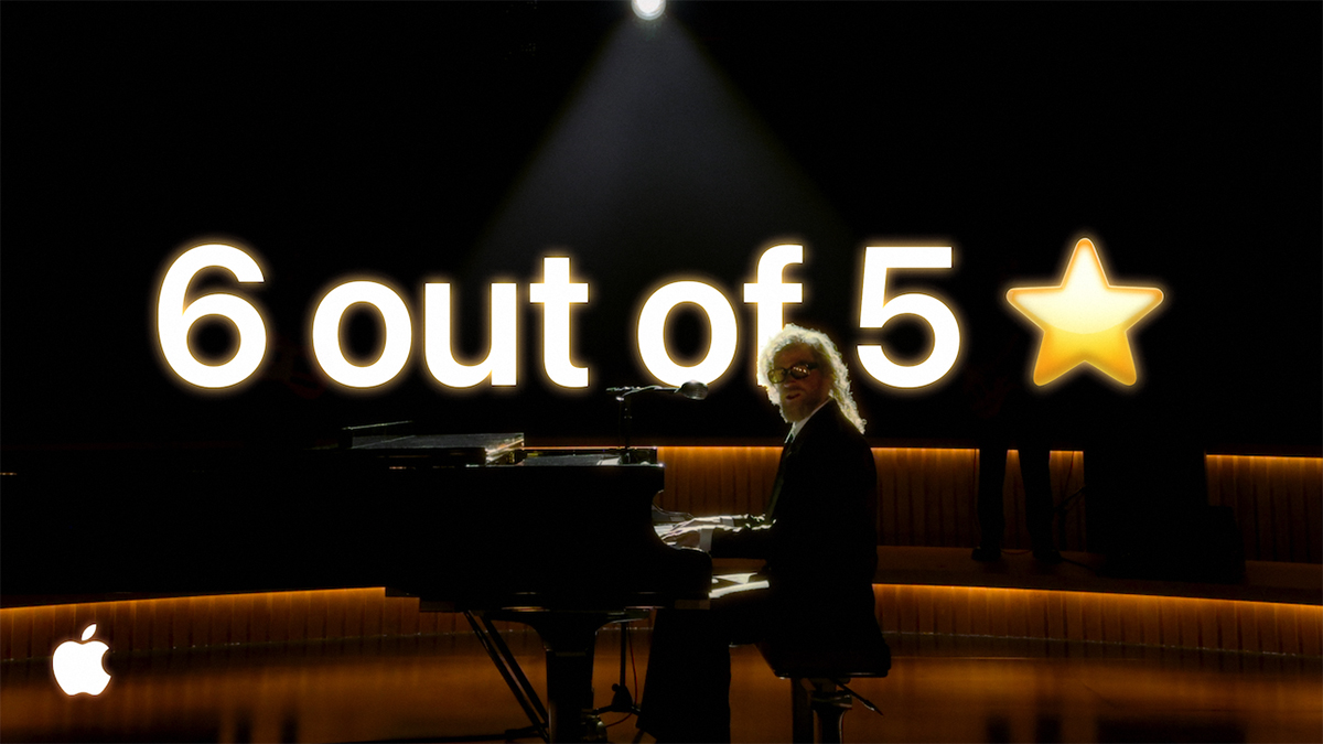 A man is seated on a darkened stage at a piano. Above him is a review of the app (Not Boring) Habits, which reads: "Changed my life (not even joking)."