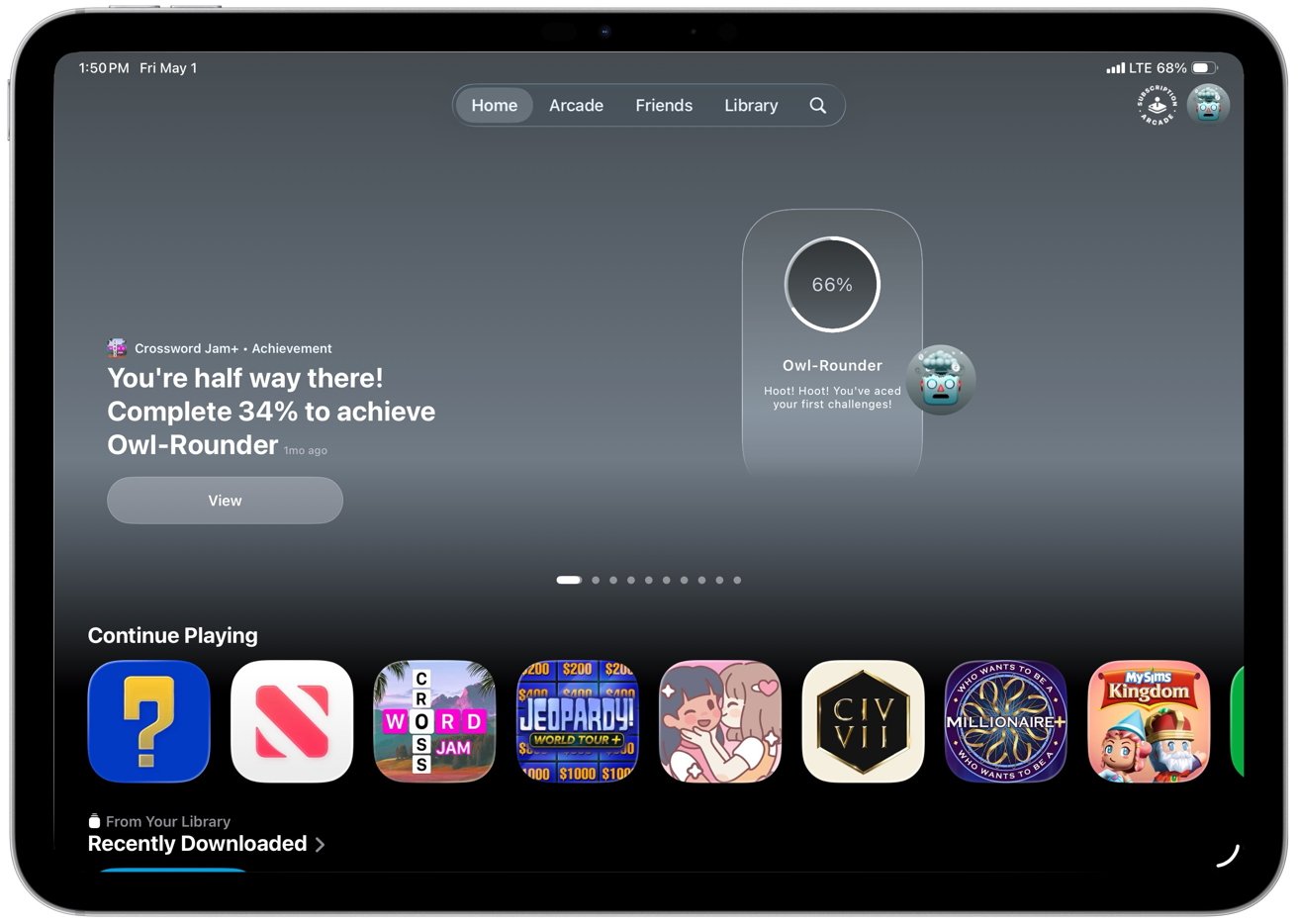 iPad Apple Arcade home screen showing achievement progress for Owl-Rounder at 66 percent, message encouraging completion, and a row of colorful game icons under Continue Playing